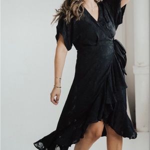 Carly Jean Los Angeles Black Wrap Dress with black slip